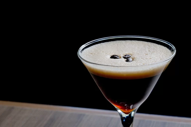 a glass with a drink in it
